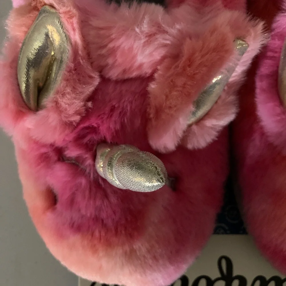 Pink fuzzy unicorn slippers by Dearfoams